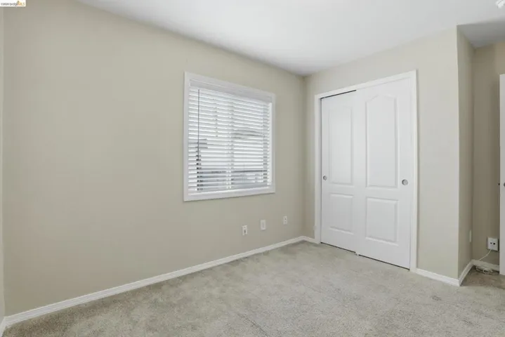 Unfurnished bedroom with carpet floors and a closet