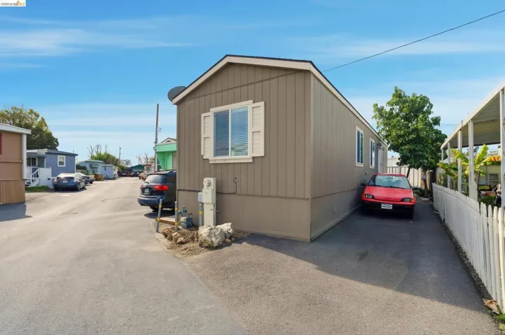 View of side of home featuring a residential view