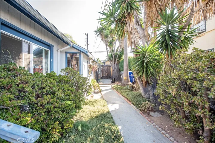 Walk way to parking and garage and alley way.