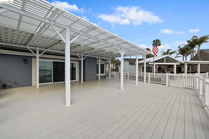 Wooden terrace featuring a pergola