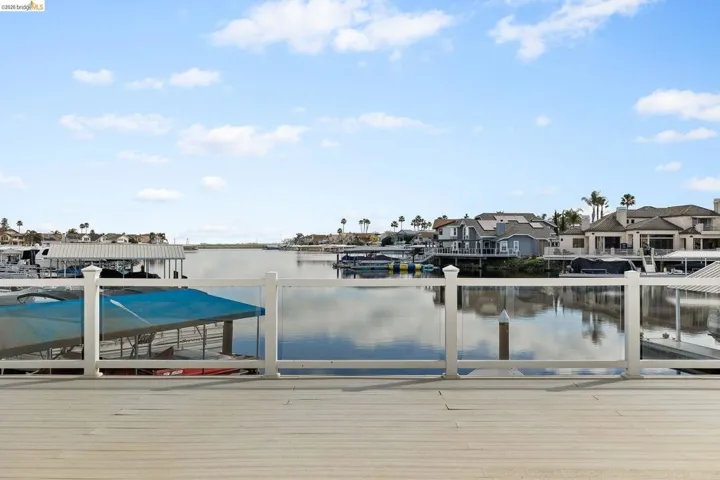 Dock featuring a water view and a residential view