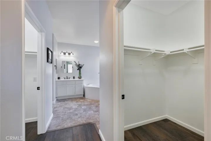 2 Walk-in Closets leading to Primary Suite Bathroom