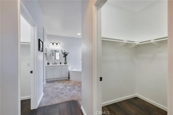 2 Walk-in Closets leading to Primary Suite Bathroom