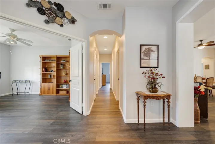 Hallway to 2 additional Bedrooms, Guest Bathroom, Laundry Room and Garage Entry