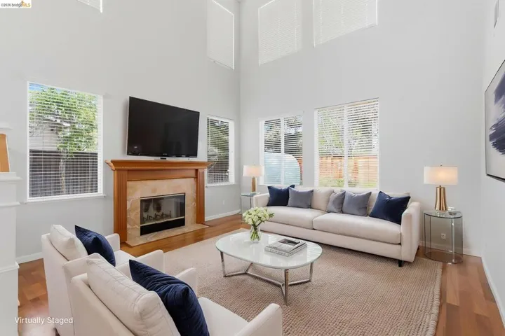 Living area with wood finished floors and a fireplace