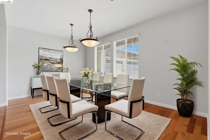 Dining space with baseboards and light wood-style floors