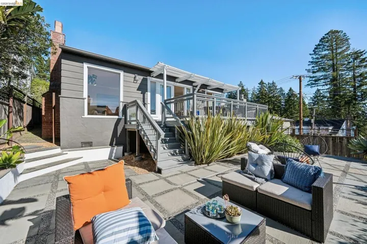 View of patio featuring an outdoor living space and stairs