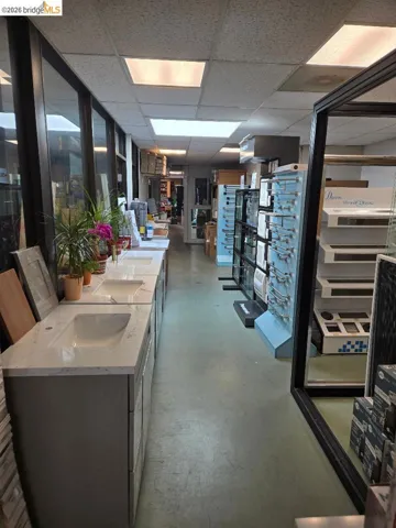 Kitchen featuring finished concrete floors and a paneled ceiling