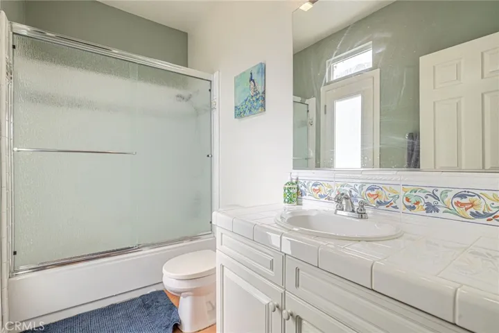 Main Level bathroom w/ access to back yard