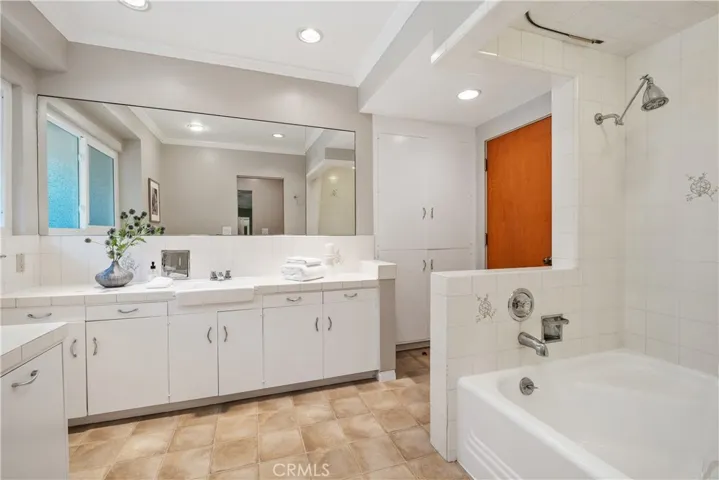 UPDATED BATHROOM WITH TUB AND SHOWER.