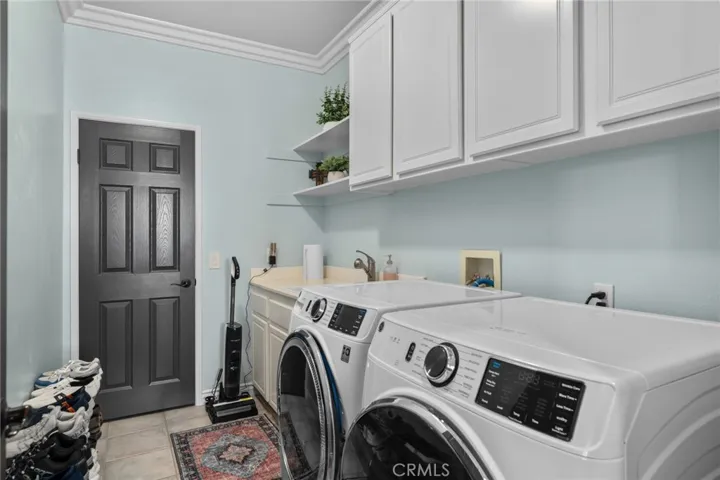 Laundry room with extra storage downstairs