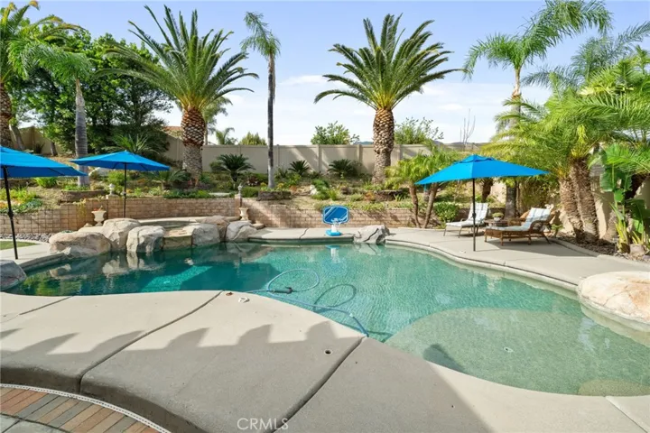 Pool and spa with umbrella slots