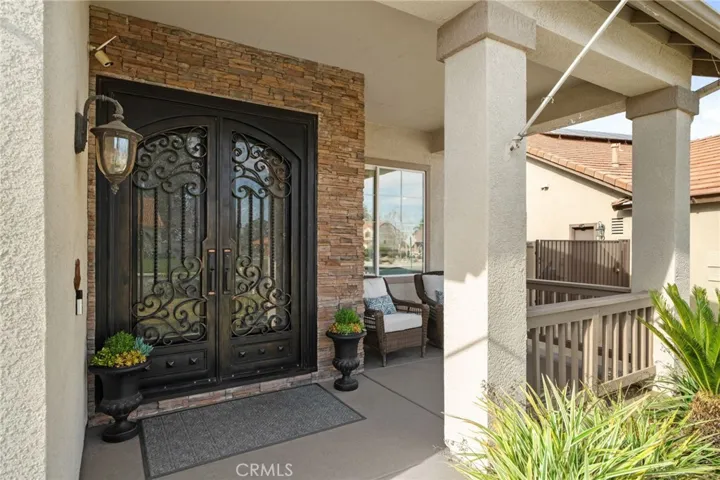 Front porch sitting area and Double iron entry doors