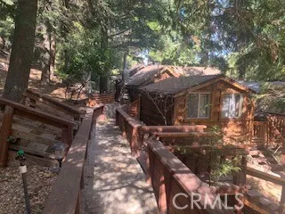 Another view of the walkway to the front door and detached bedroom.