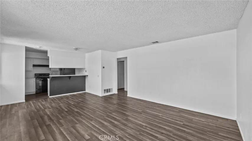 Living room, looking into kitchen