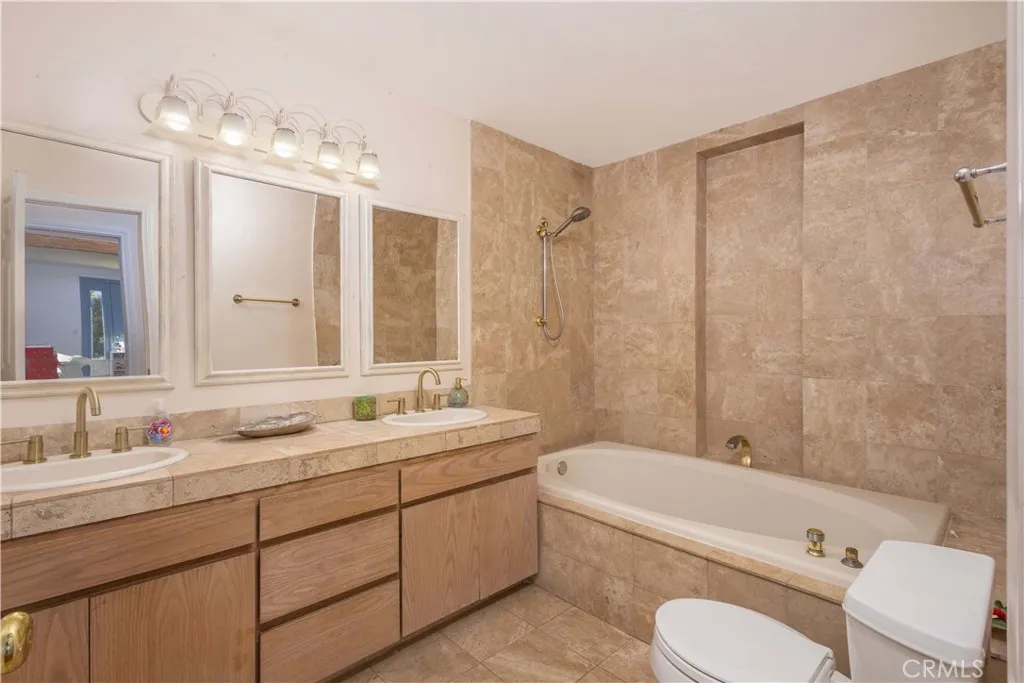 Secondary bathroom with updated tile.