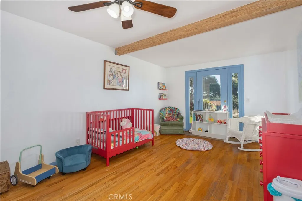 Bedroom one with real hardwood floors