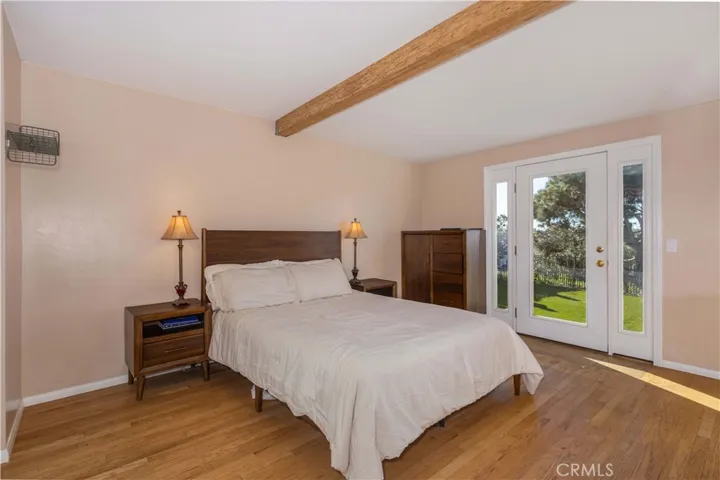 Primary Bedroom with real hardwood floors