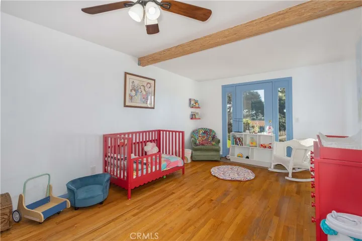Bedroom one with real hardwood floors
