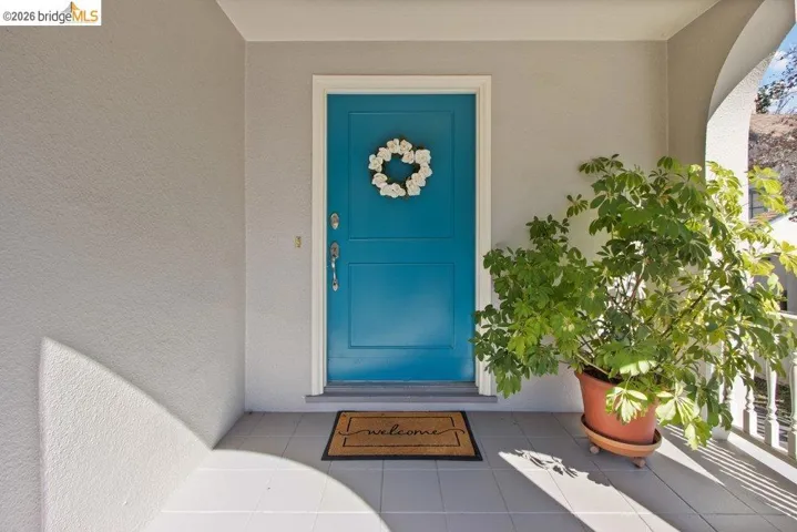 View of exterior entry featuring stucco siding
