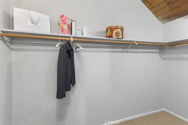 Primary bedroom walk-in closet