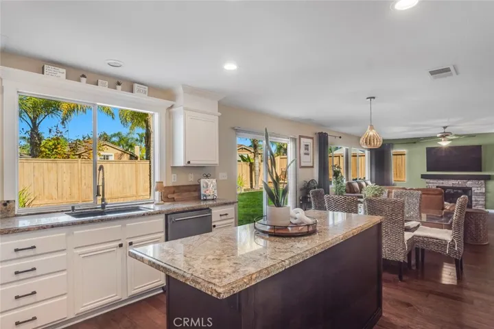 A large window over the sink lets sunlight pour in, creating a bright and welcoming kitchen.