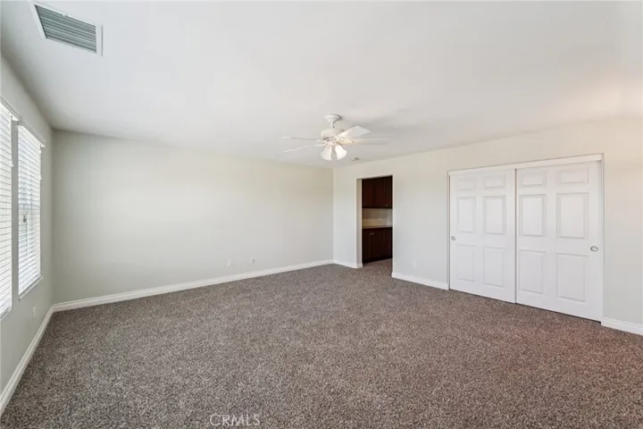 Multi-purpose upstairs suite with private bath and storage space