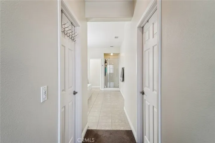 Dual walk-in closets offering ample storage
