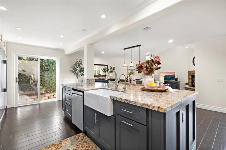 Designer tile backsplash, stainless steel appliances