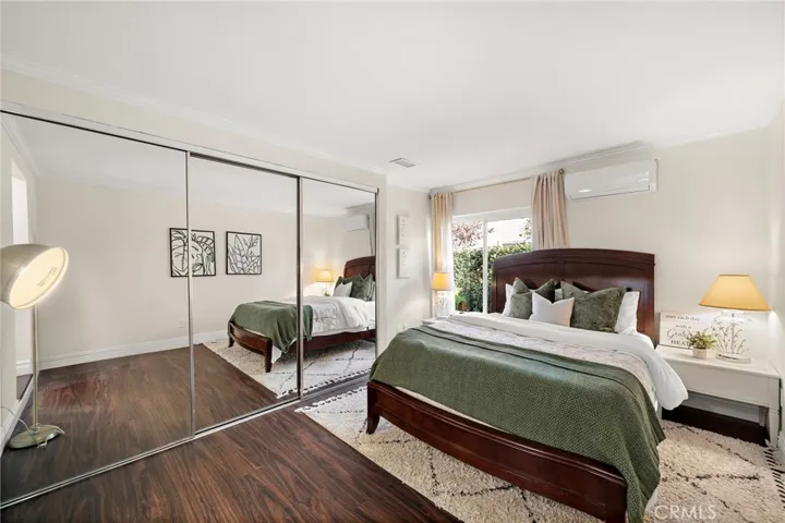 Spacious first floor master suite with mirrored wardrobe
