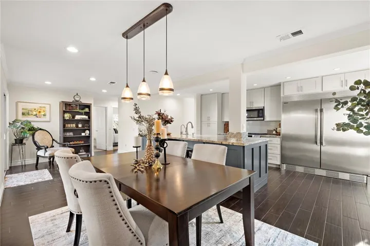 Breakfast bar opens seamlessly to the expanded dining and family rooms