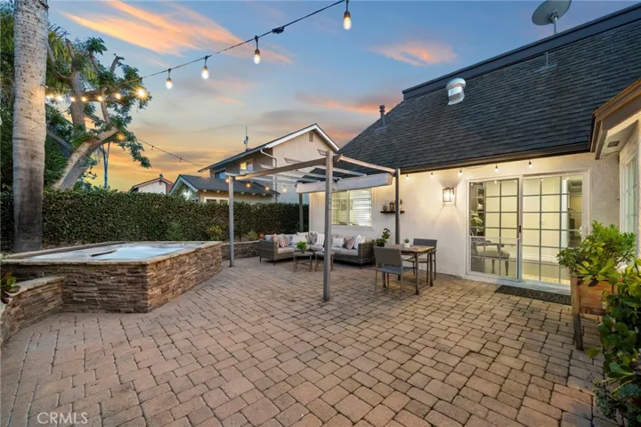 sliding glass door access, stylish pavers, raised planter beds