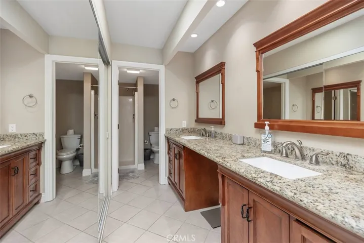 Ensuite bathroom ( that is a reflection in the mirror closet door of the shower room where the toilet is)