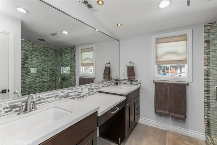 En-suite primary bath with dual vanities