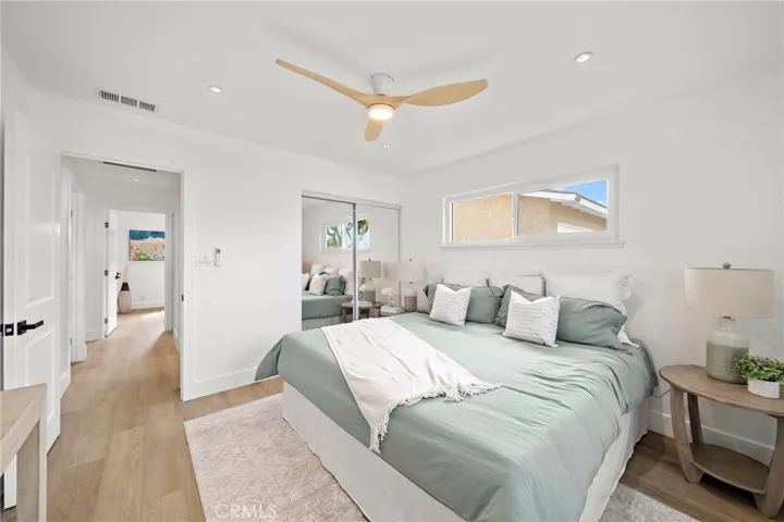 The primary bathroom has been fully remodeled with a stylish vanity, LED touch-light mirror, and a tub/shower combination with designer tile surround, while the half bath is also brand new and conveniently configured as a Jack & Jill between the secondary bedrooms.