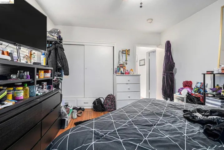 Bedroom featuring light wood-style flooring and a closet