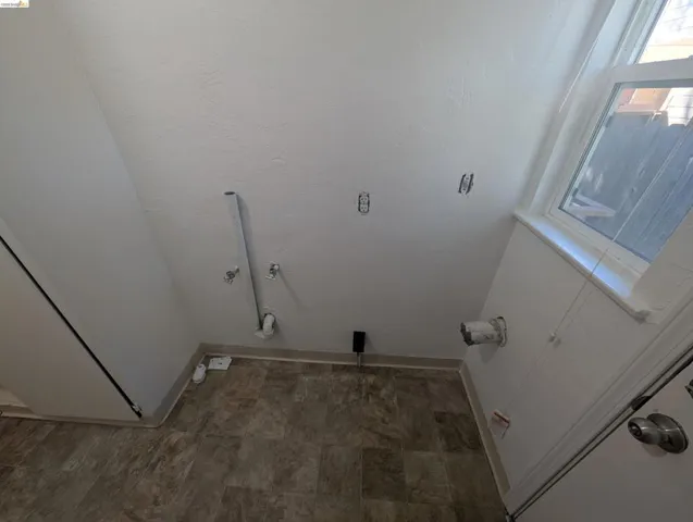 Laundry area with baseboards