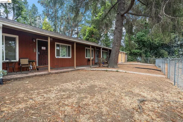 View of front of house with roof with shingles