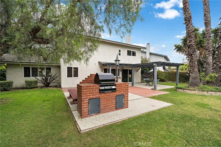 gas fire ring, built-in Fire Magic barbecue center, rose or vegetable garden area, and a side yard wide enough for a pool—creating your own private outdoor oasis.