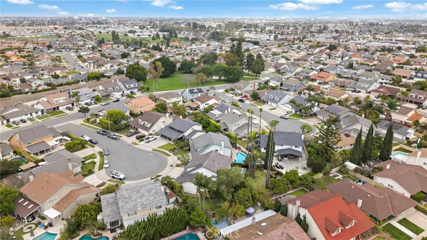 newer concrete tile roof, brick planters, and a welcoming covered front porch