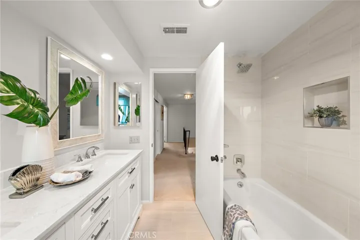 Completely Remolded Hall Way Bathroom with Quartz Countertop