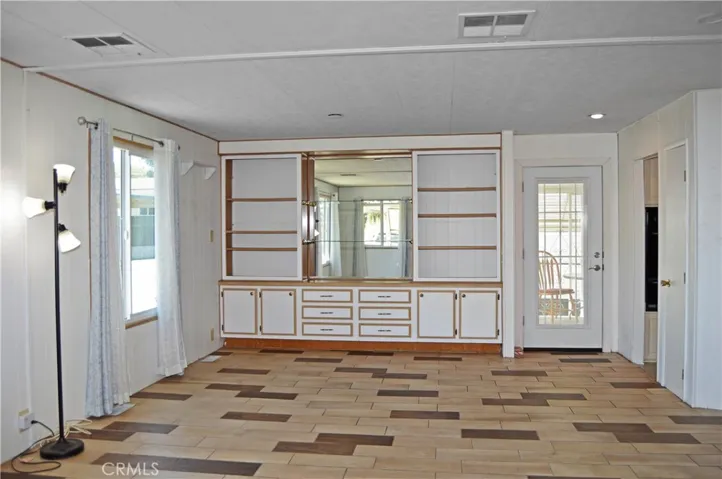 Custom tile and built-in hutch in this dining room with a view