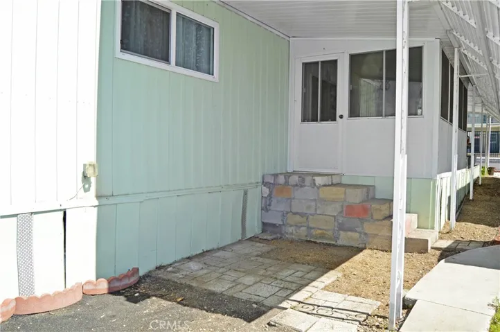 Covered yard space at the back corner (park wants stairs replaced, so these will change)