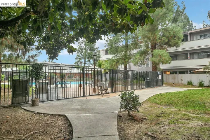 View of property's community with a swimming pool
