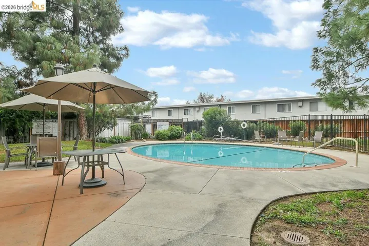 Community pool with a patio area