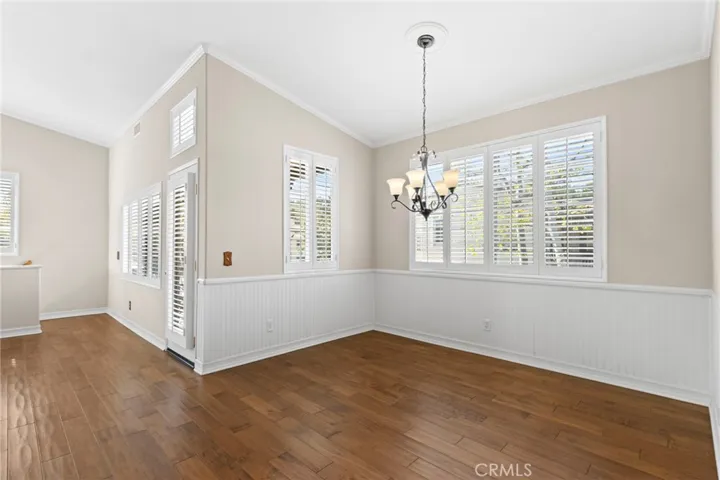 Formal dining area With Wainscoting & Beautiful Hardwood Flooring