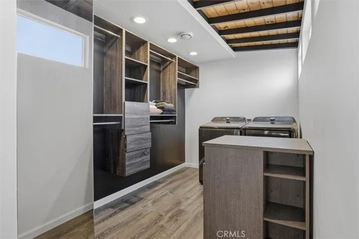 Primary bedroom closet with laundry