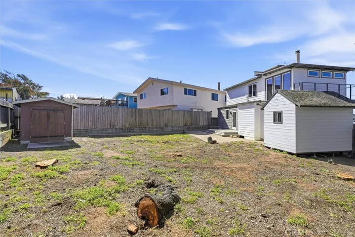 Back yard with views of the sheds