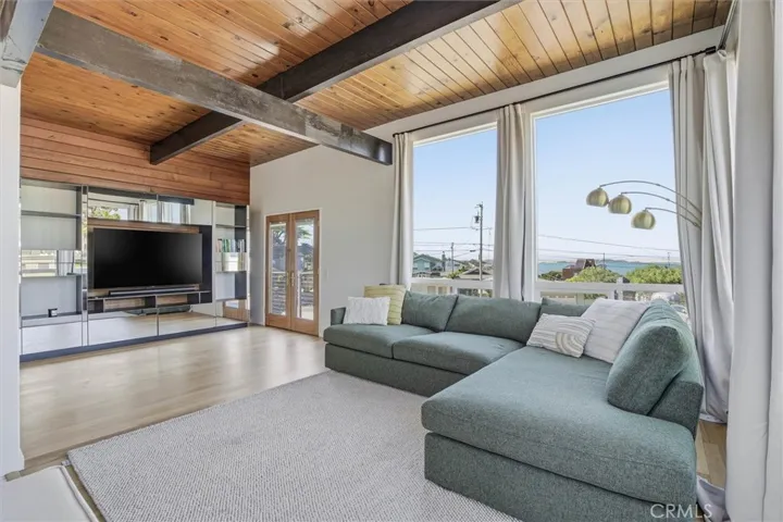 Living room with bay and rock views!