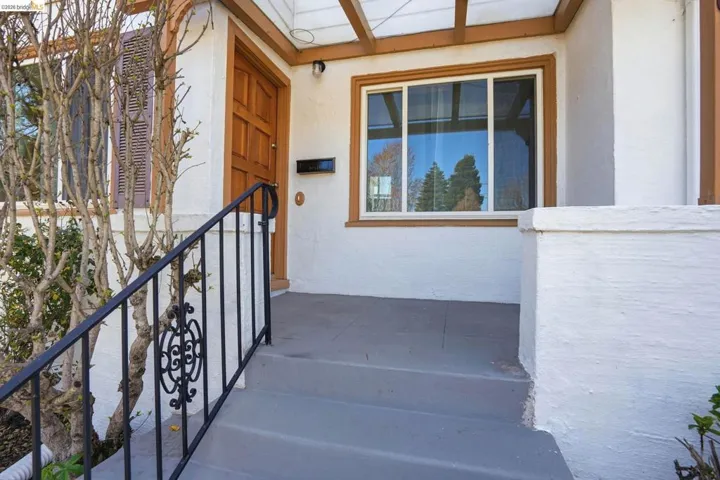 Property entrance featuring stucco siding